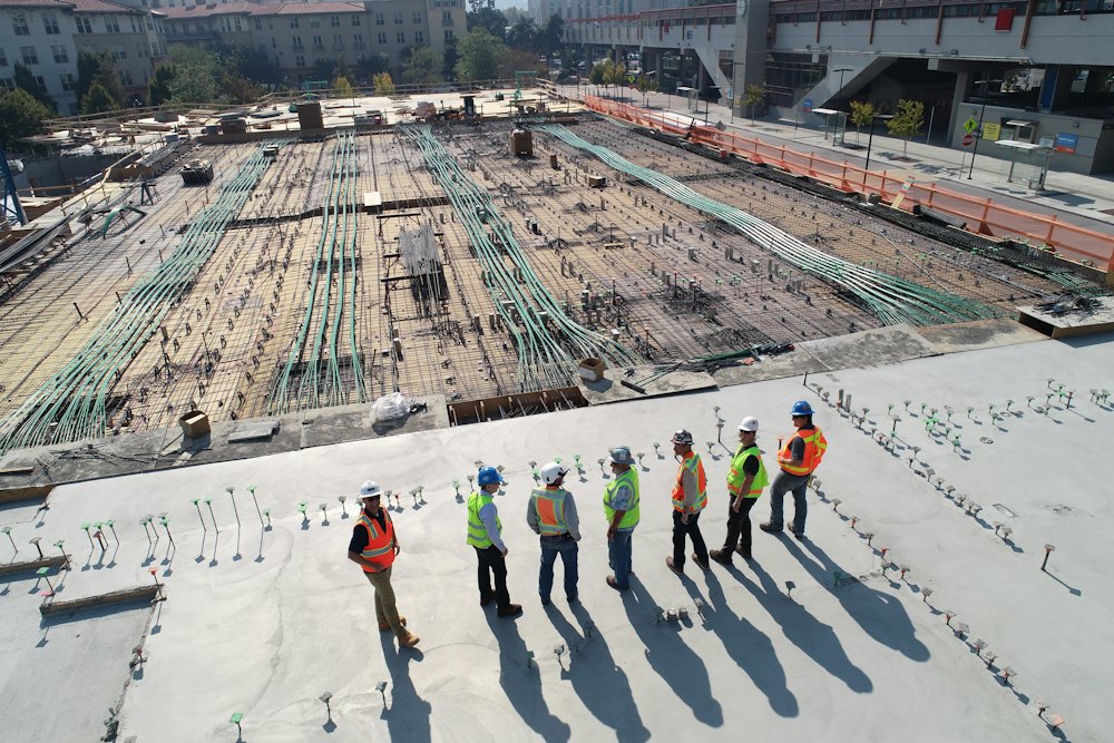 Construction crew in safety vests on a job site in California